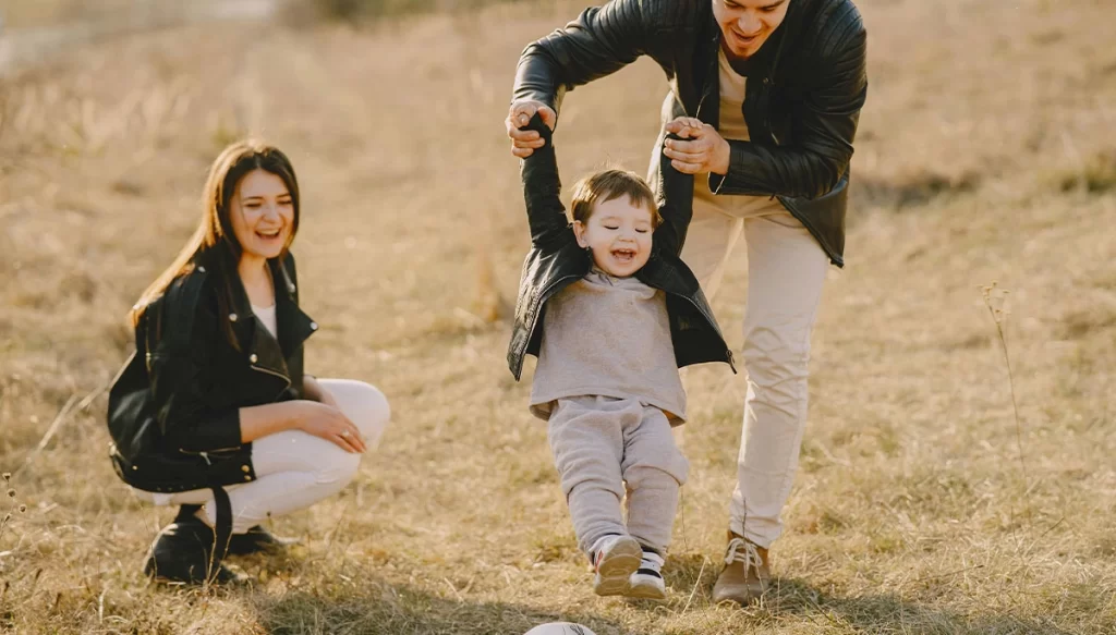 child playing with family